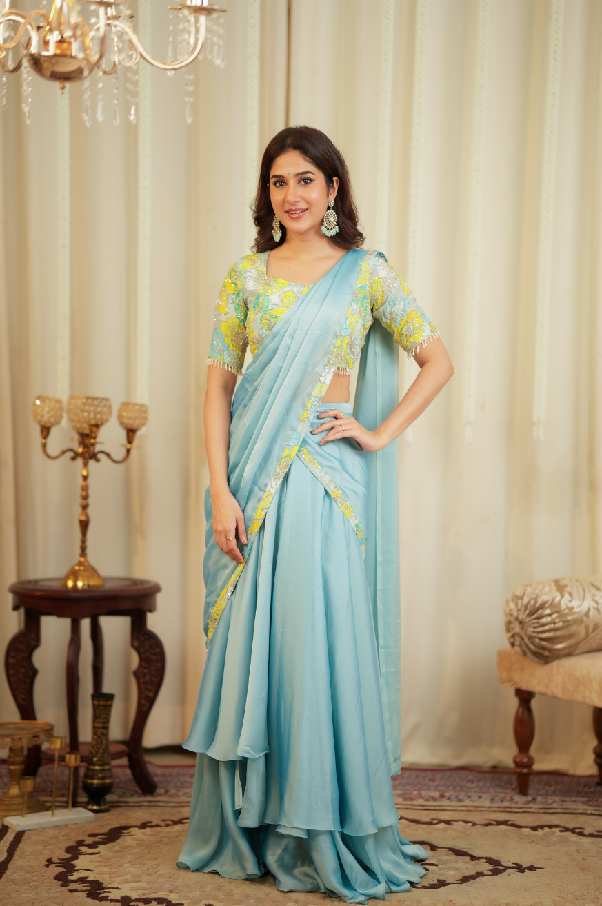 designer lehenga with layered skirt and attached dupatta
